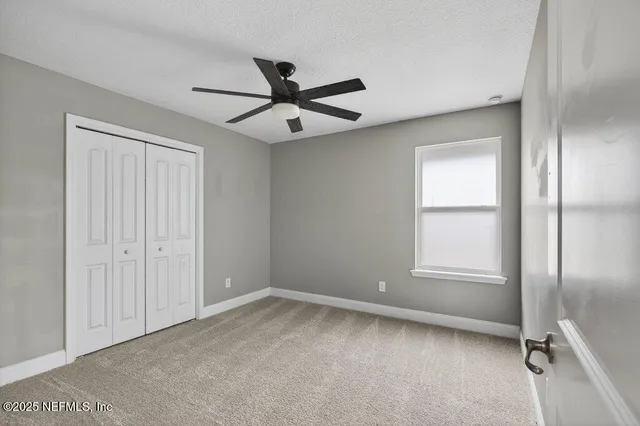 an aerial view of residential houses with outdoor space and swimming pool