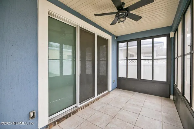 an aerial view of a house with a swimming pool