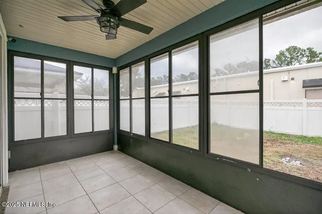 an aerial view of houses with yard