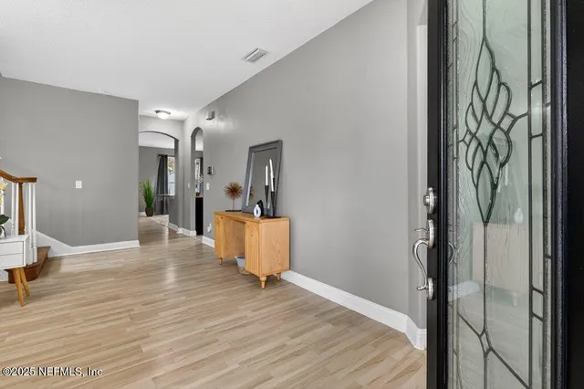 a view of a living room and dining room