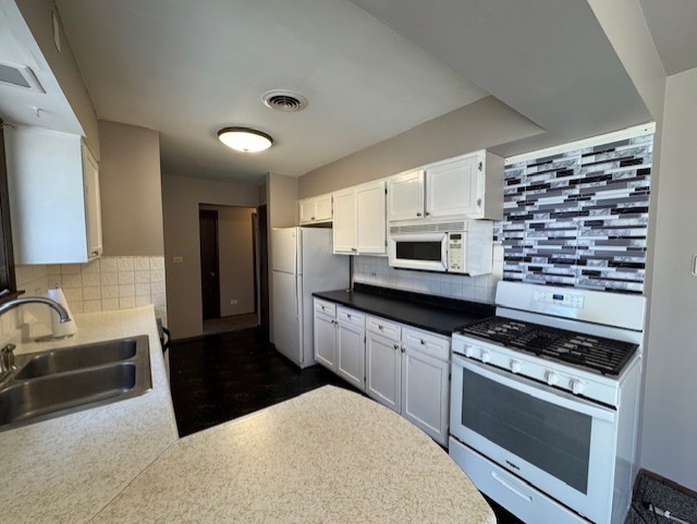 707 Crestview Drive Ingleside, IL 60041 - Photo 9 of 15 a kitchen with stainless steel appliances a sink a stove a microwave a sink and cabinets