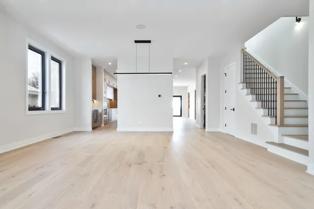 a kitchen with stainless steel appliances a sink and cabinets