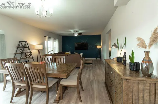 a view of a dining room with furniture and wooden floor