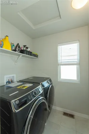 a bathroom with a sink a mirror a toilet and a window