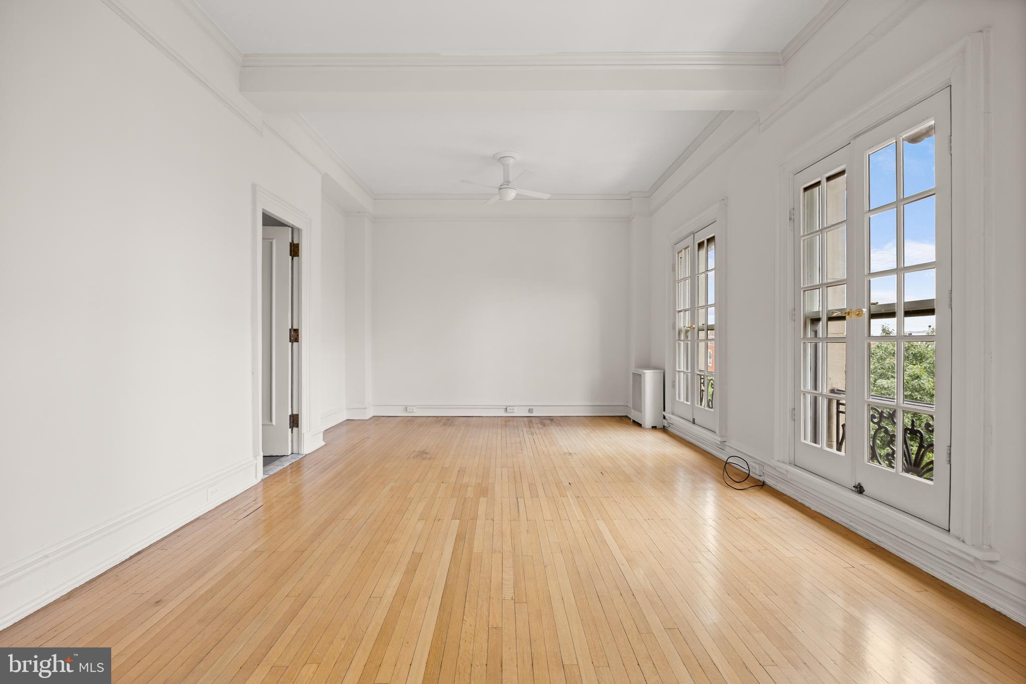 700 Washington Place, Unit 4B Baltimore, MD 21201 - Photo 23 of 67 wooden floor in an empty room with a window