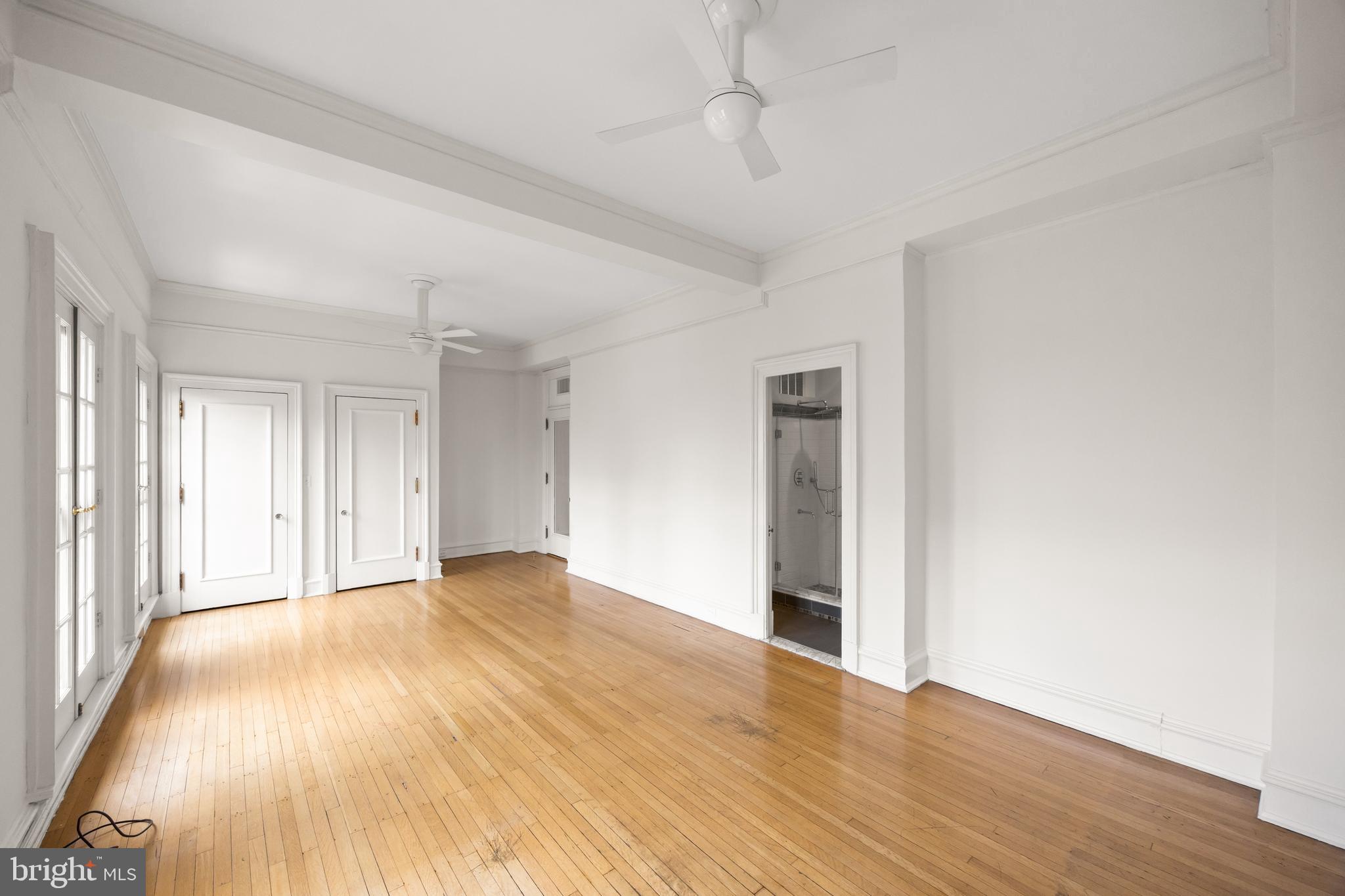 700 Washington Place, Unit 4B Baltimore, MD 21201 - Photo 25 of 67 a view of an empty room with wooden floor