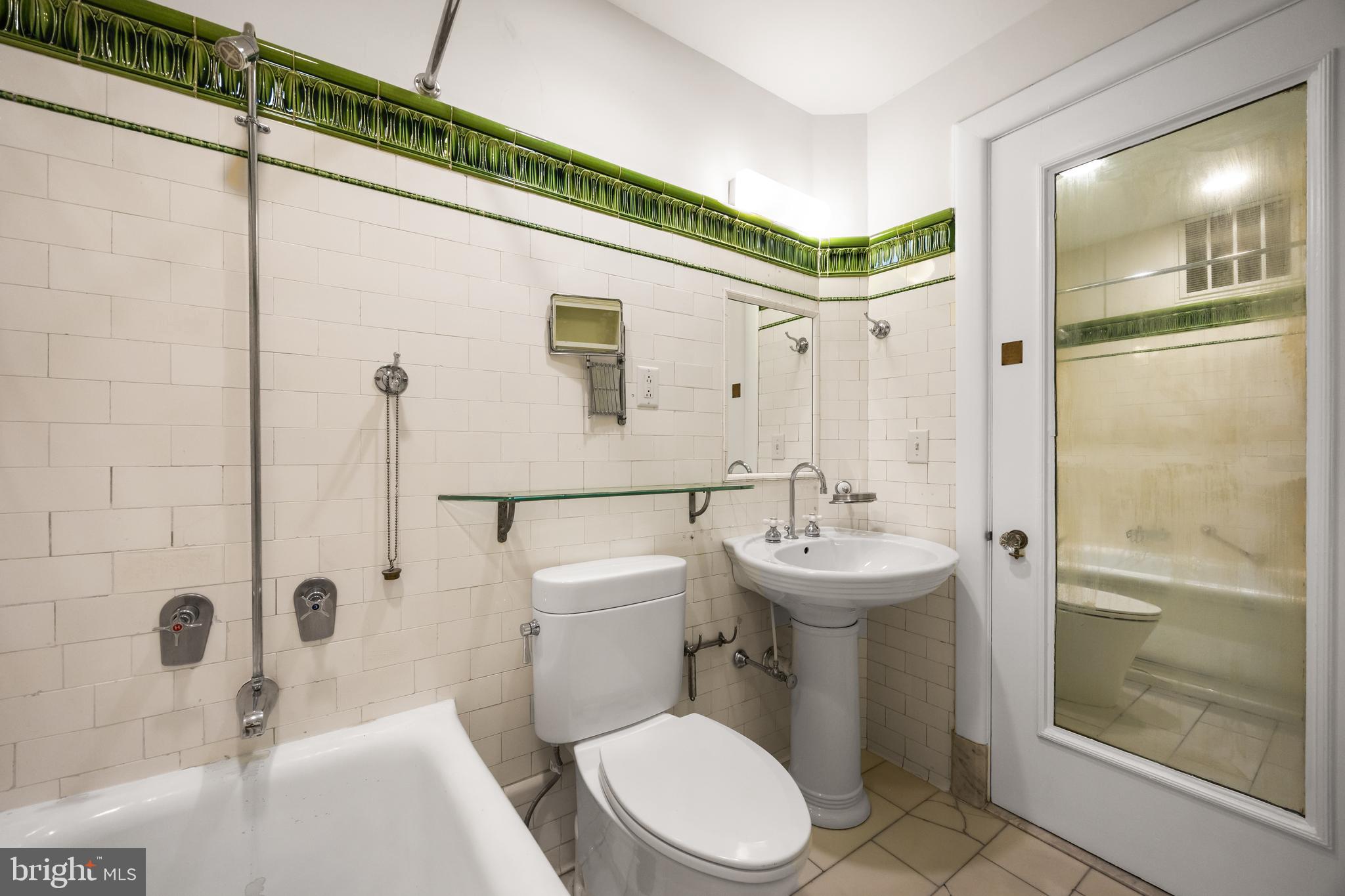 700 Washington Place, Unit 4B Baltimore, MD 21201 - Photo 40 of 67 a bathroom with a sink a toilet and shower