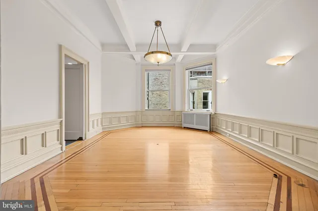 a kitchen with stainless steel appliances a stove a sink and a microwave