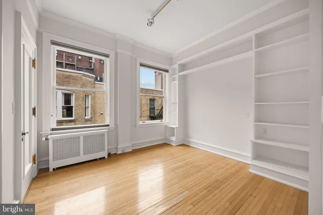 a kitchen with stainless steel appliances granite countertop a refrigerator and a stove