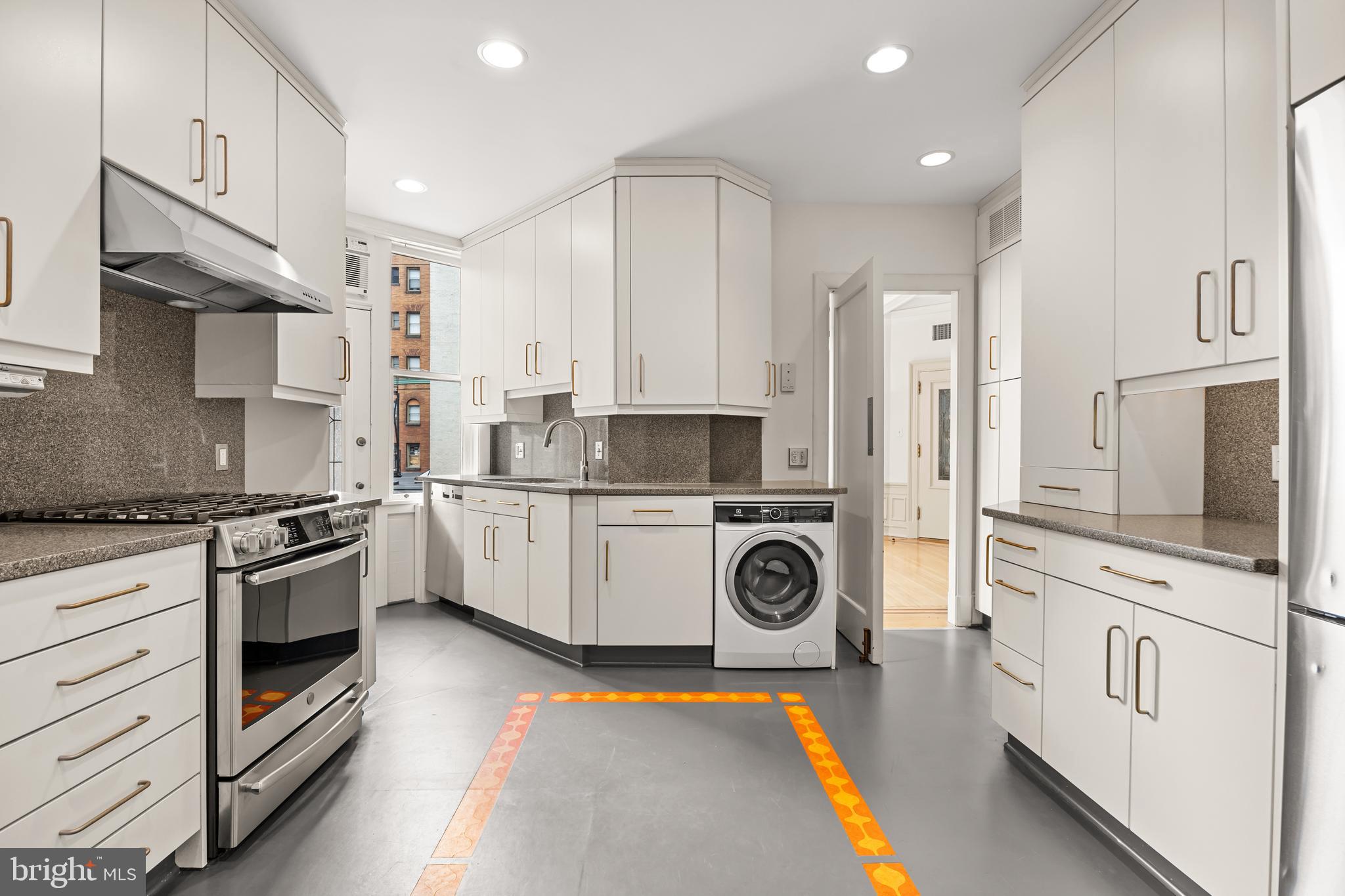 700 Washington Place, Unit 4B Baltimore, MD 21201 - Photo 56 of 67 a kitchen with stainless steel appliances granite countertop a stove a sink and a refrigerator