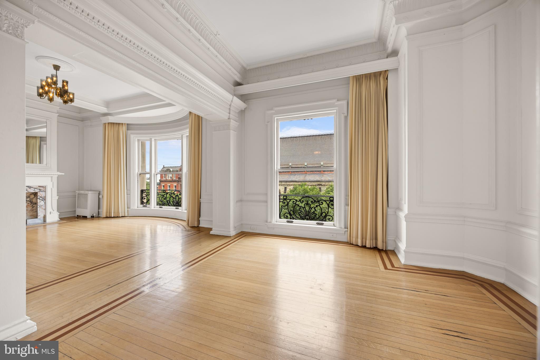 700 Washington Place, Unit 4B Baltimore, MD 21201 - Photo 9 of 67 a view of an empty room with window and wooden floor