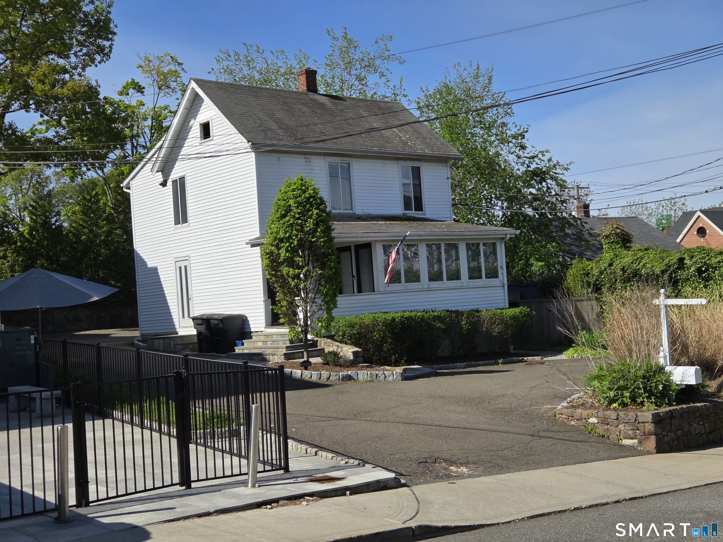 19 Ketchum Street Westport, CT 06880 - Photo 2 of 4 a view of street along with house and trees