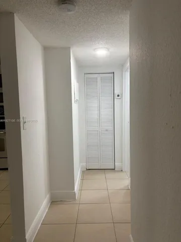 a room with a table and chairs