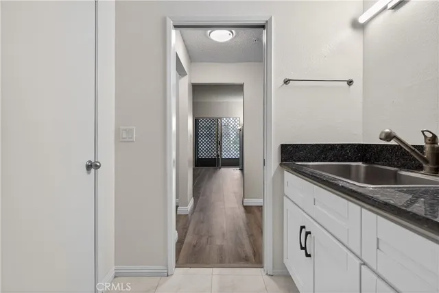 a kitchen with a sink and cabinets