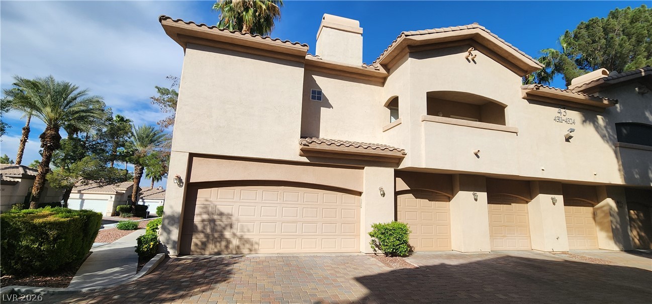 2050 West Warm Springs Road, Unit 4323 Henderson, NV 89014 - Photo 4 of 48 View of front facade featuring a tiled roof and stucco siding