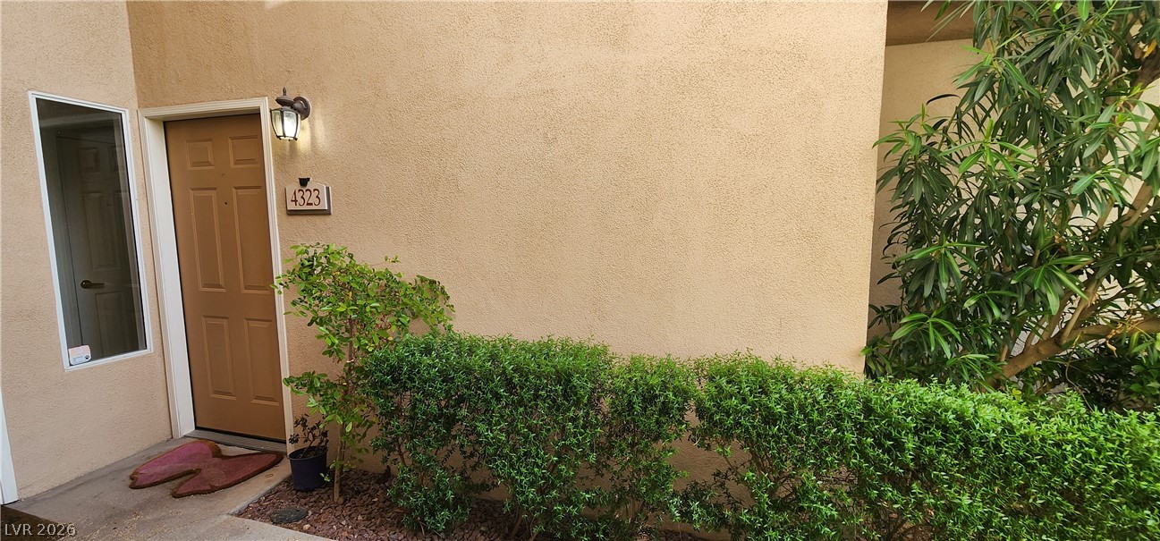 2050 West Warm Springs Road, Unit 4323 Henderson, NV 89014 - Photo 9 of 48 View of exterior entry with stucco siding