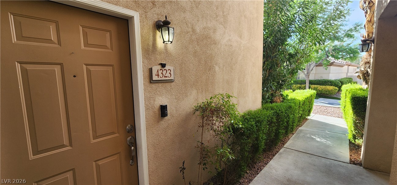 2050 West Warm Springs Road, Unit 4323 Henderson, NV 89014 - Photo 10 of 48 Doorway to property with stucco siding