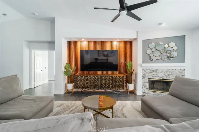 a living room with furniture and a fireplace