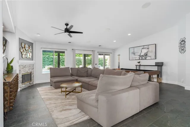 a living room with furniture and a fireplace