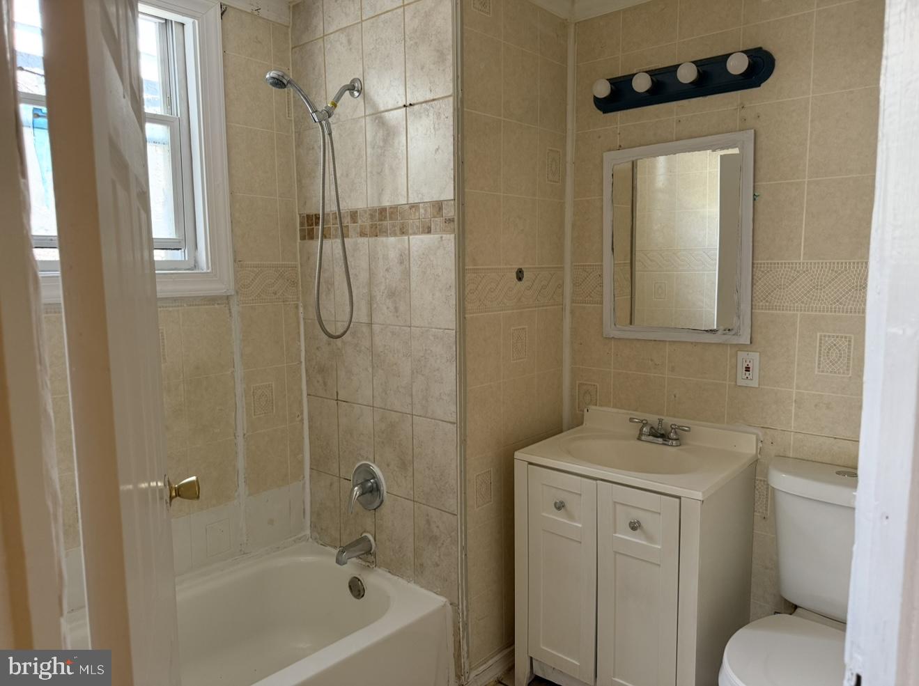 669 Long Lane Upper Darby, PA 19082 - Photo 11 of 19 a bathroom with a sink a toilet and shower