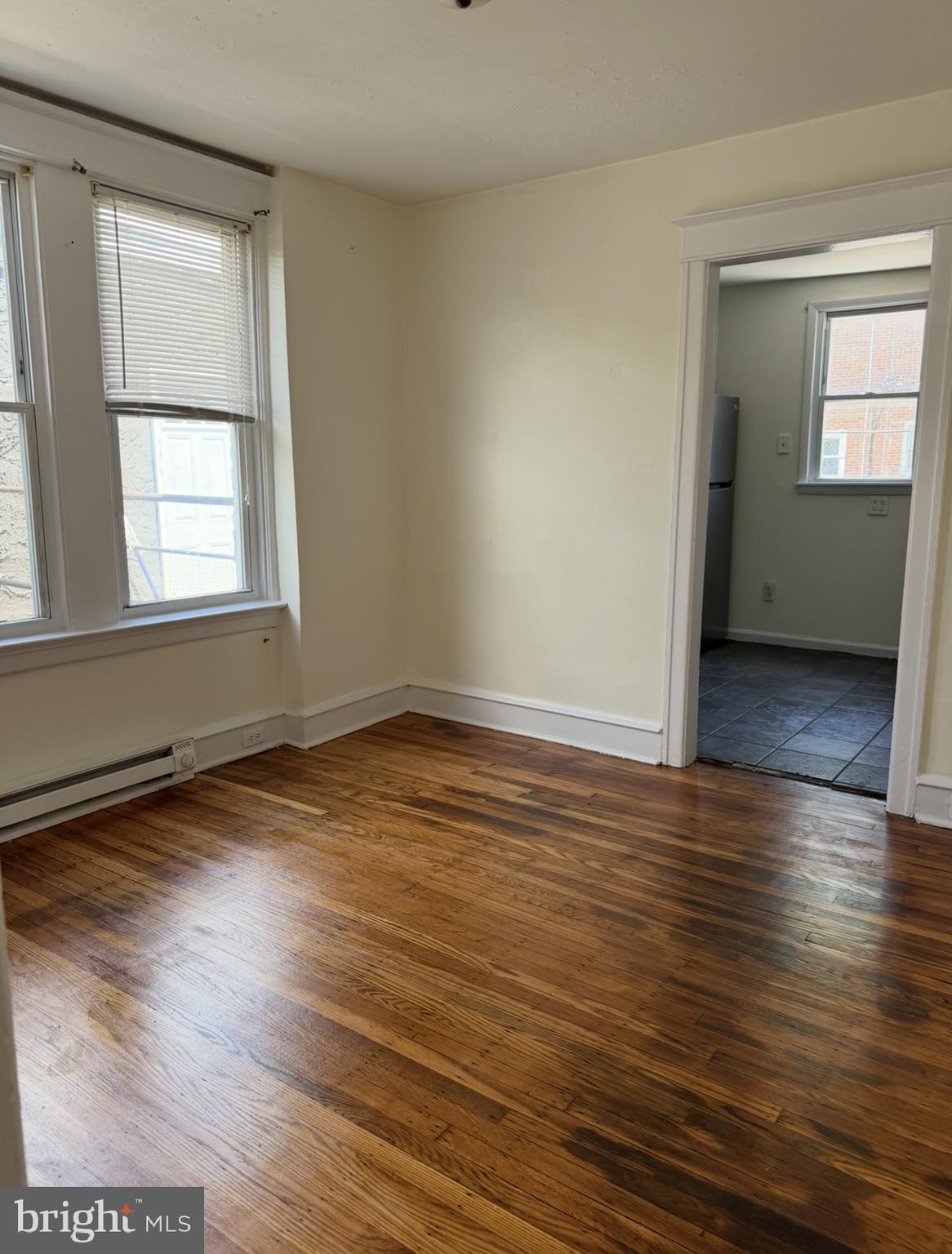 669 Long Lane Upper Darby, PA 19082 - Photo 14 of 19 an empty room with wooden floor and windows