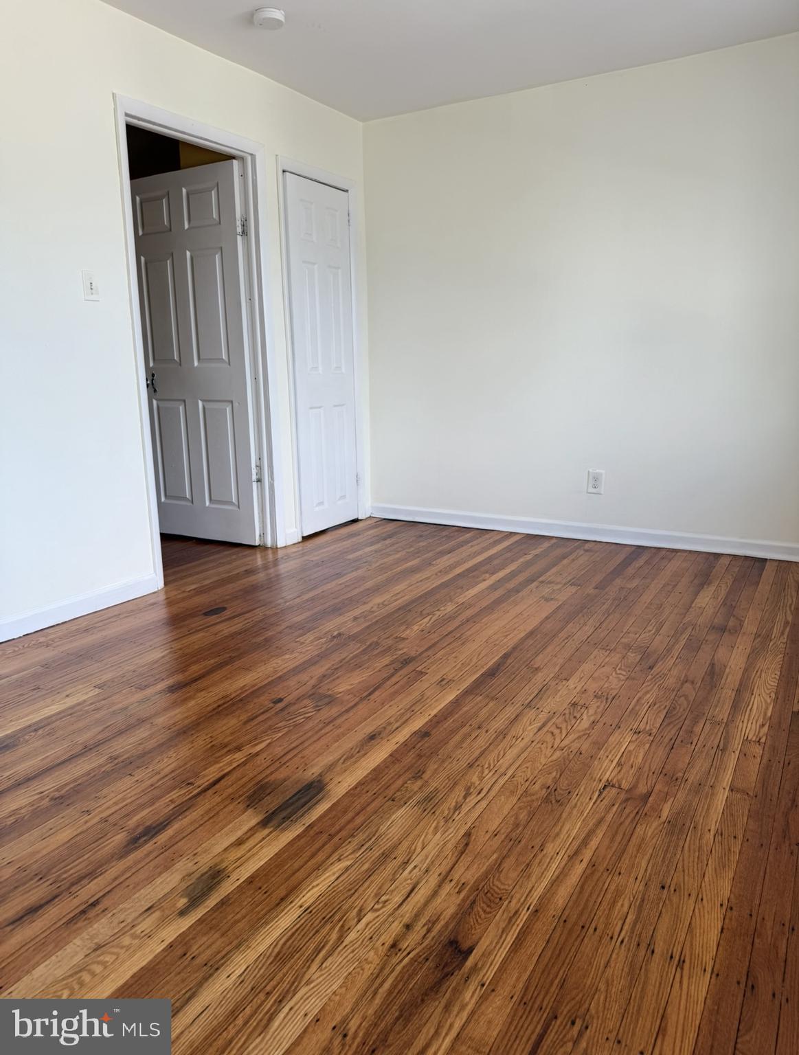 669 Long Lane Upper Darby, PA 19082 - Photo 16 of 19 a view of an empty room with wooden floor