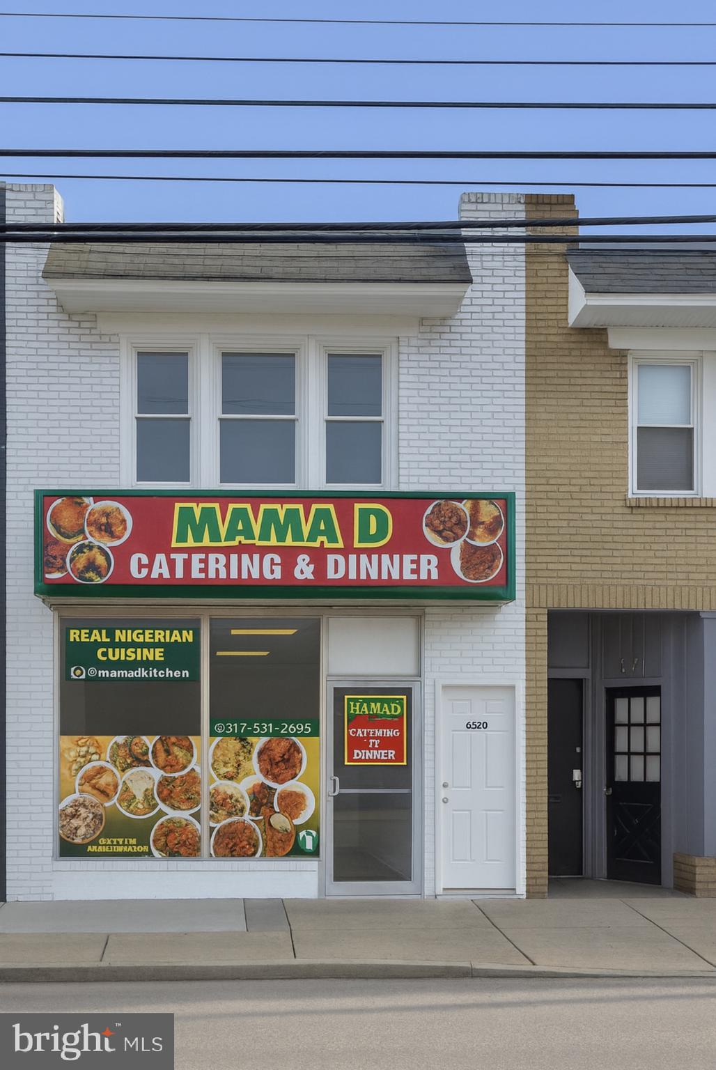669 Long Lane Upper Darby, PA 19082 - Photo 18 of 19 a front view of a building with retail shops