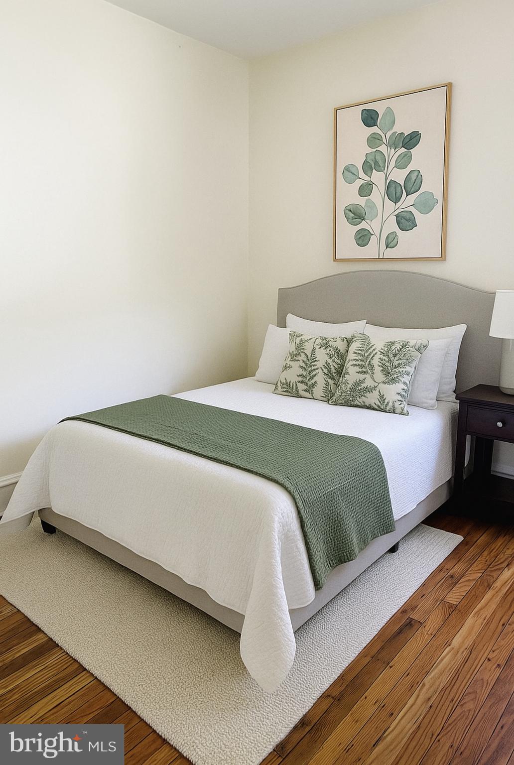 669 Long Lane Upper Darby, PA 19082 - Photo 2 of 19 a bedroom with a bed and painting on the wall