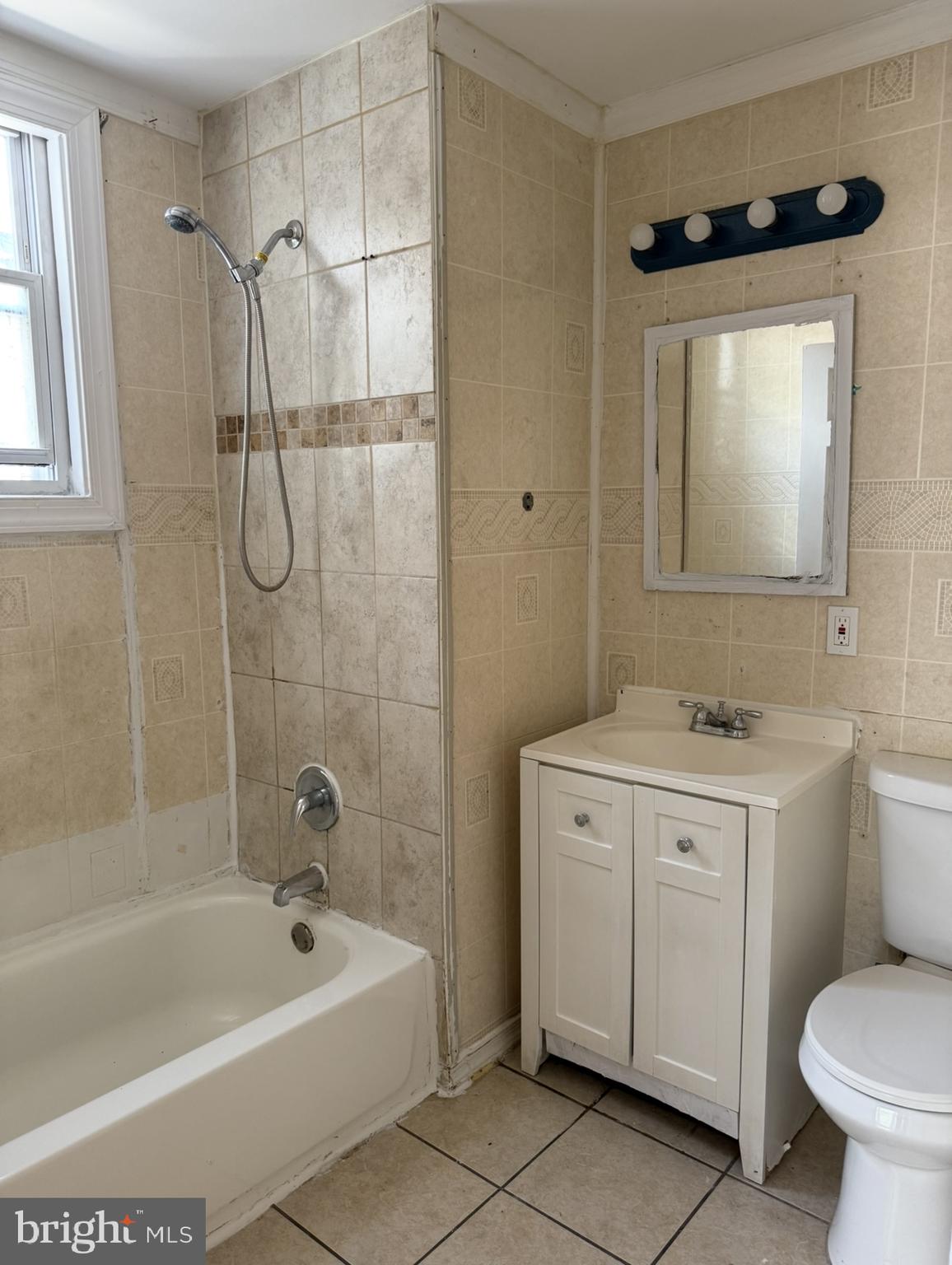 669 Long Lane Upper Darby, PA 19082 - Photo 9 of 19 a bathroom with a sink a toilet and shower