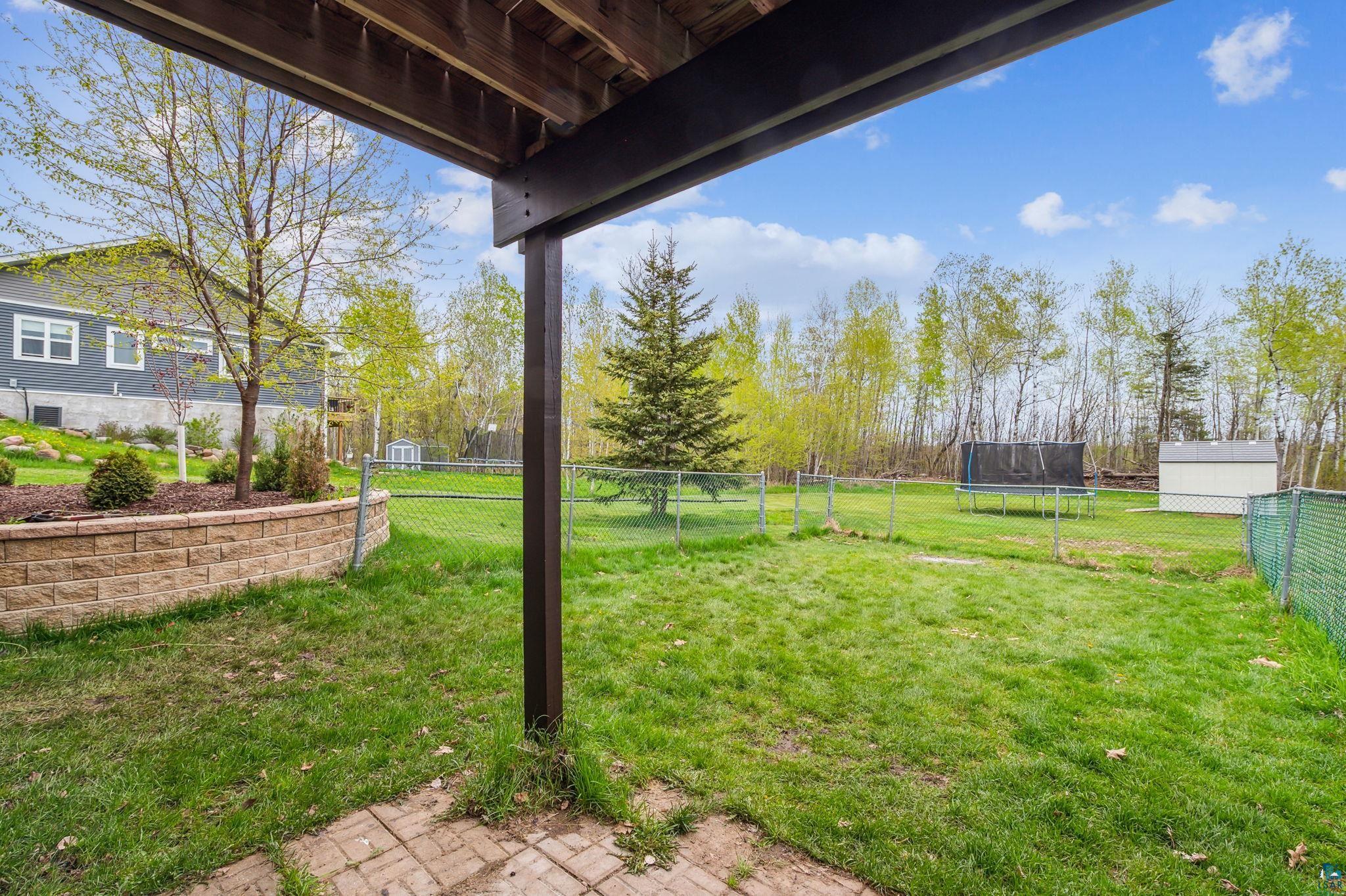4372 Ugstad Road Hermantown, MN 55811 - Photo 15 of 21 View of yard featuring a trampoline