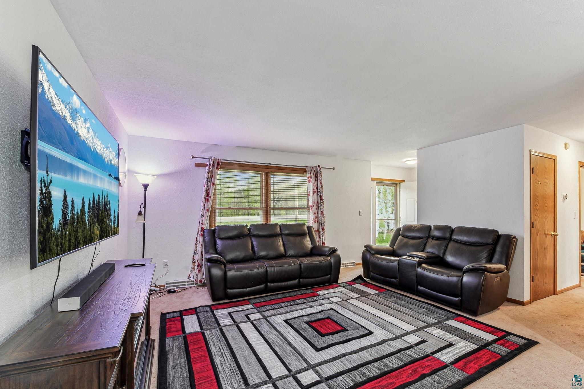 Living room featuring carpet floors