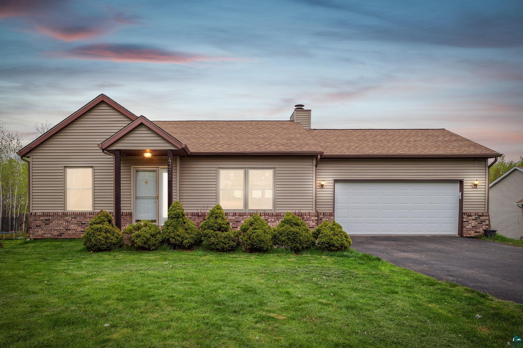 4372 Ugstad Road Hermantown, MN 55811 - Photo 21 of 21 Ranch-style house featuring a garage and a yard