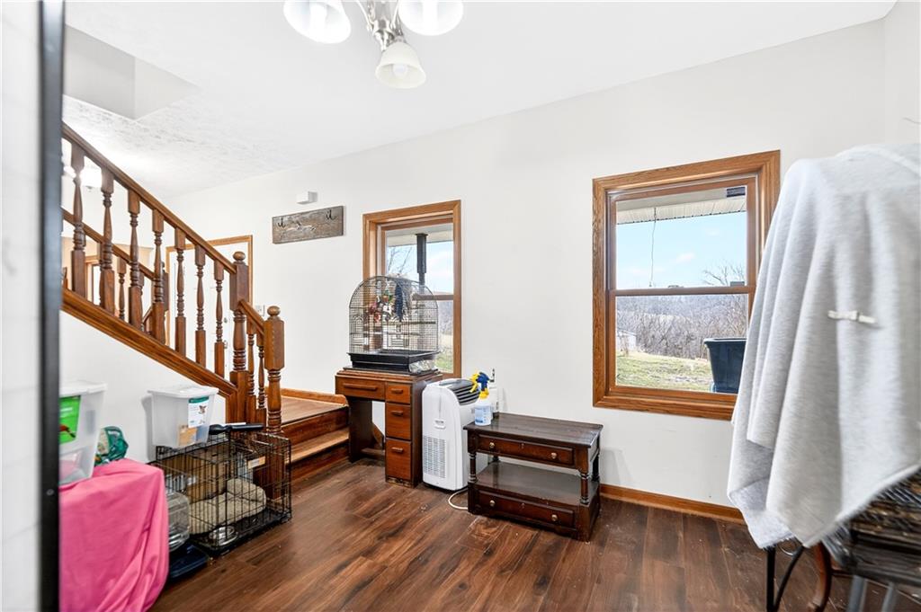 220 Main Road West Alexander, PA 15376 - Photo 14 of 44 a living room with furniture a fireplace and a window