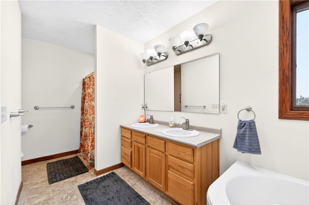 220 Main Road West Alexander, PA 15376 - Photo 22 of 44 a bathroom with a sink vanity and mirror