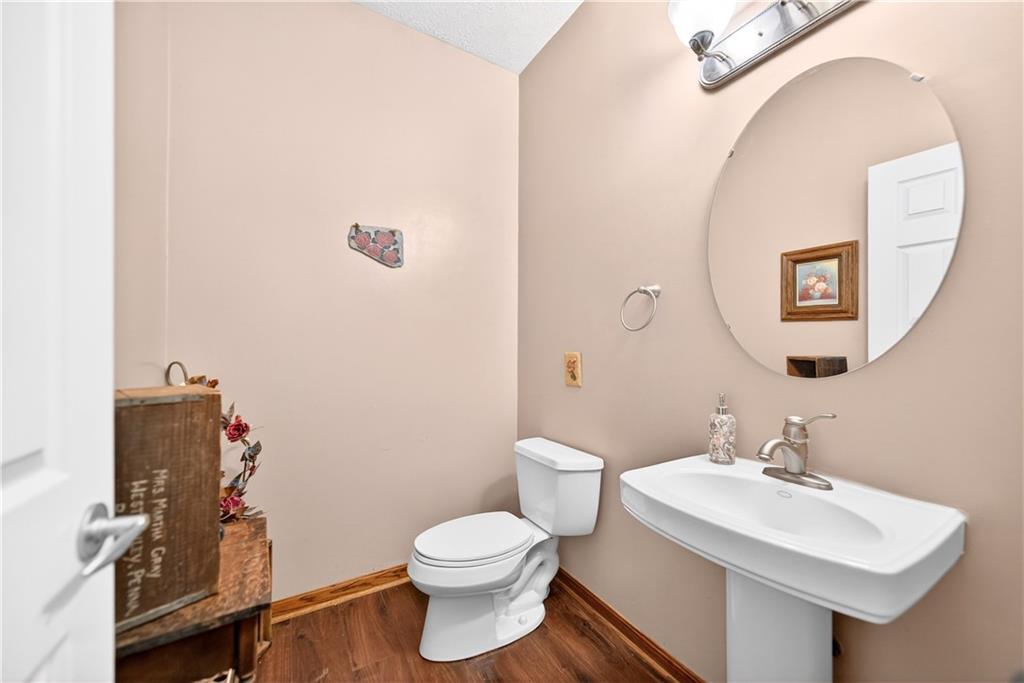 220 Main Road West Alexander, PA 15376 - Photo 29 of 44 a bathroom with a toilet sink and mirror