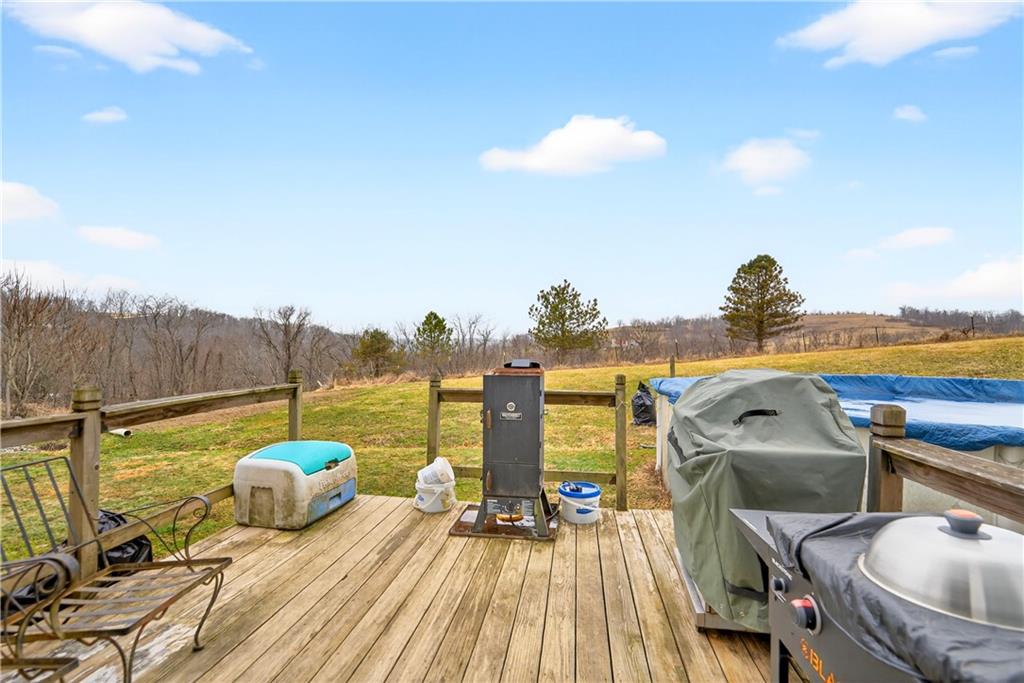 220 Main Road West Alexander, PA 15376 - Photo 33 of 44 a view of a balcony with two chairs and a table