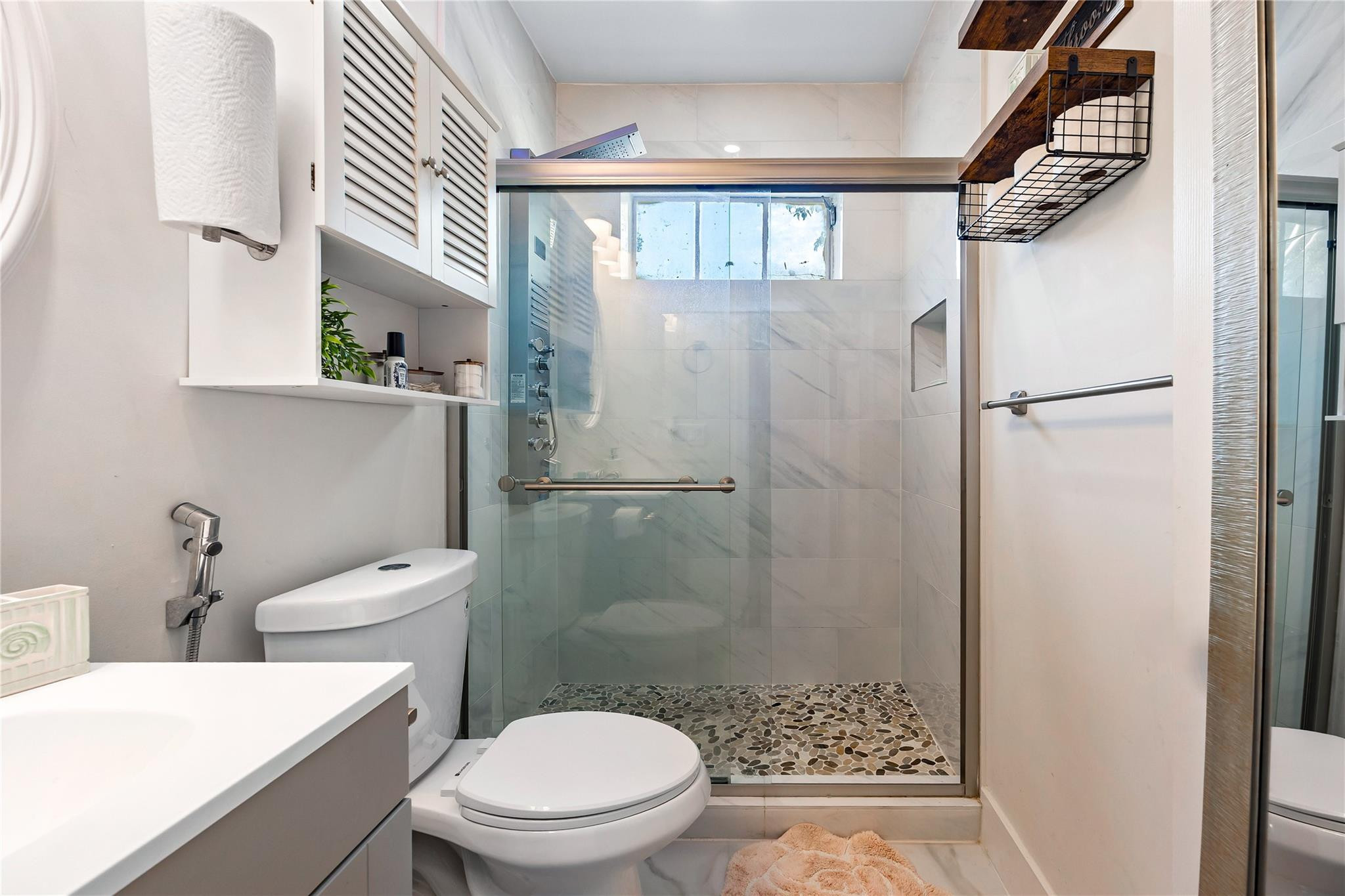 218 Southwest 7th Street Dania Beach, FL 33004 - Photo 27 of 57 a bathroom with a toilet and a shower