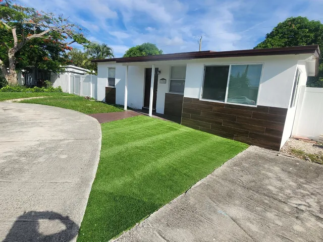 a view of outdoor space with deck and yard