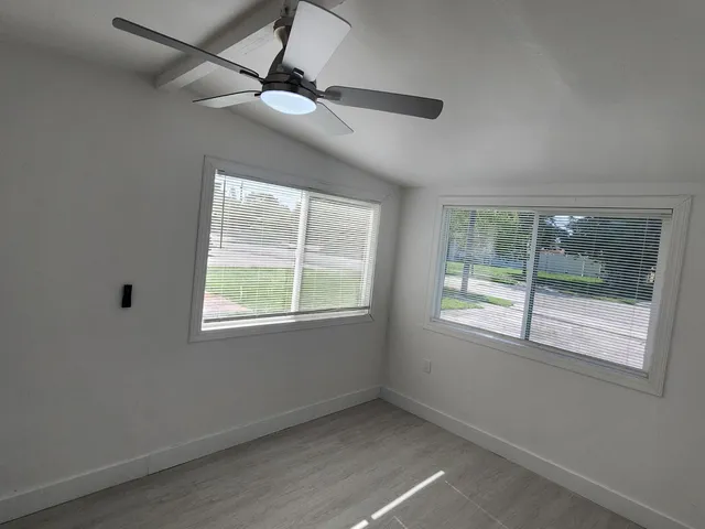 a view of an empty room with a window