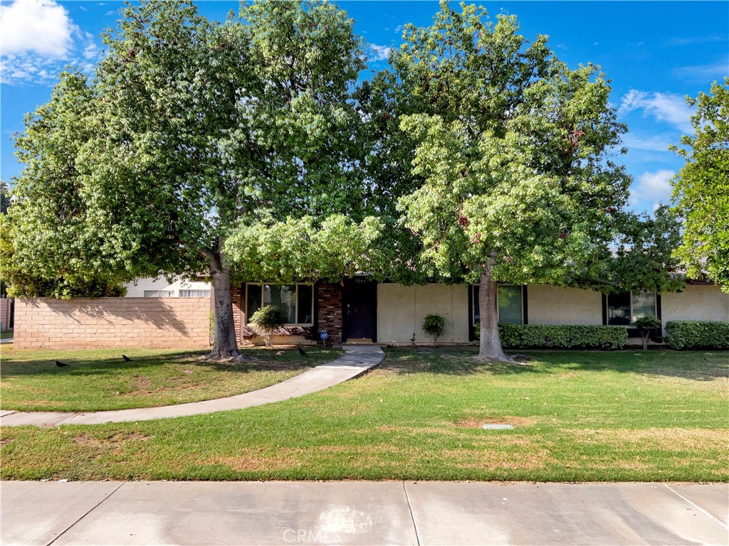 9264 Delano Drive Riverside, CA 92503 - Photo 1 of 1 a view of a backyard with a sitting area and slide
