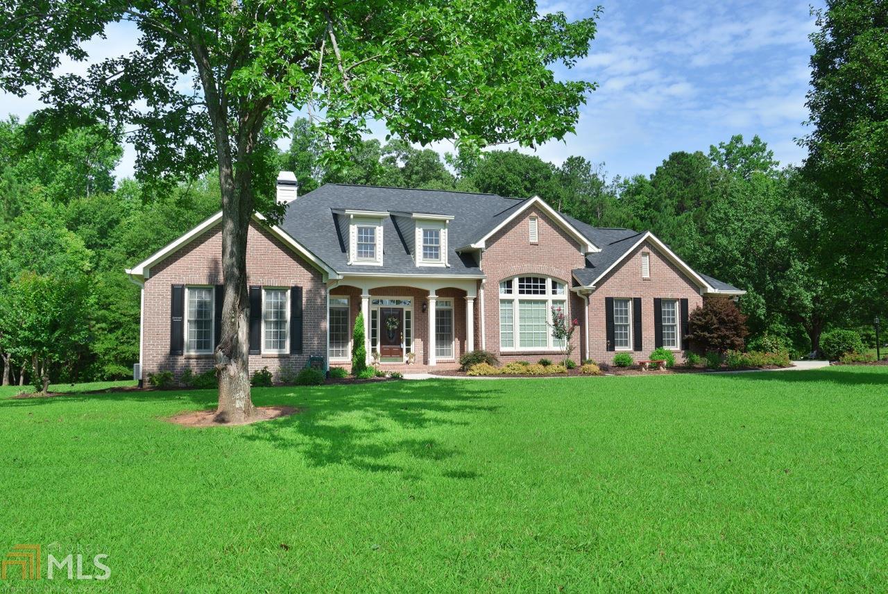 555 Ebenezer Road Fayetteville, GA 30215 - Photo 1 of 1 a front view of a house with a yard