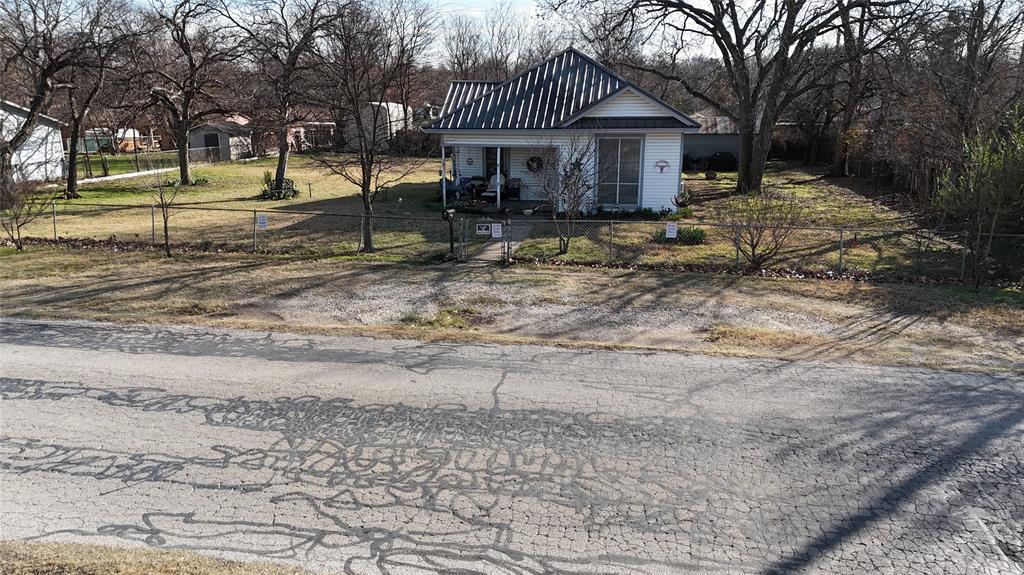 213 West Eldred Street, Unit 2 Burleson, TX 76028 - Photo 11 of 22 a view of a house with backyard and trees