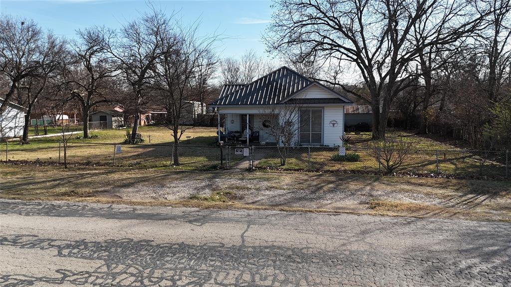 213 West Eldred Street, Unit 2 Burleson, TX 76028 - Photo 12 of 22 a view of a house with a yard covered in snow