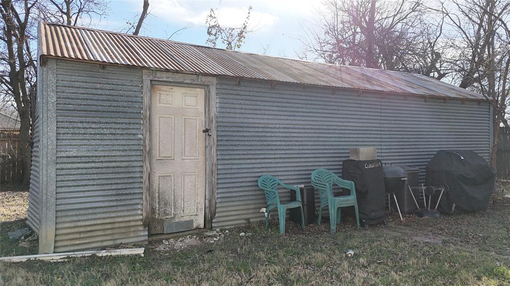 213 West Eldred Street, Unit 2 Burleson, TX 76028 - Photo 20 of 22 a view of a house with backyard and sitting area