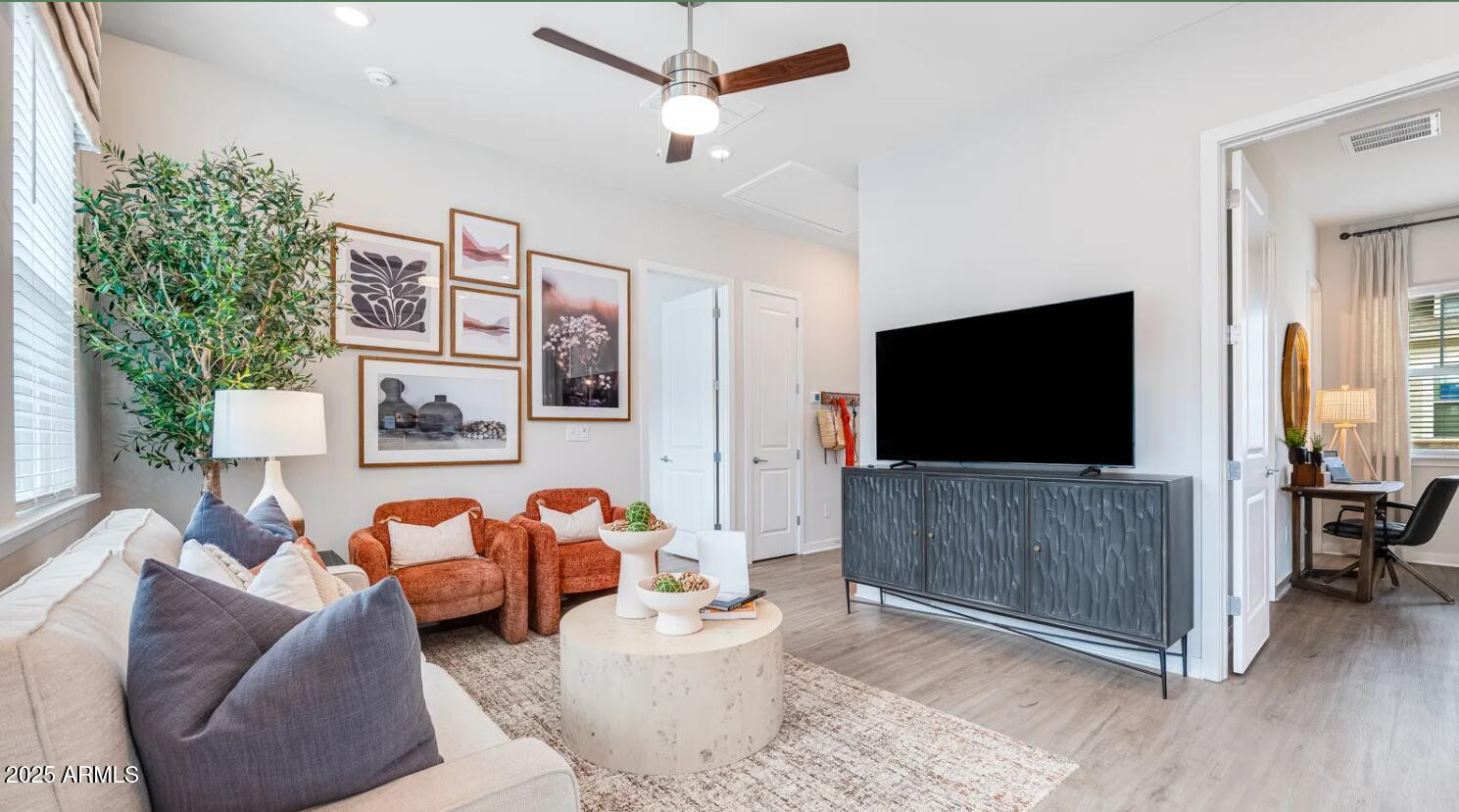 20807 West Indian School Road, Unit 2 Buckeye, AZ 85396 - Photo 2 of 9 a living room with furniture and a flat screen tv