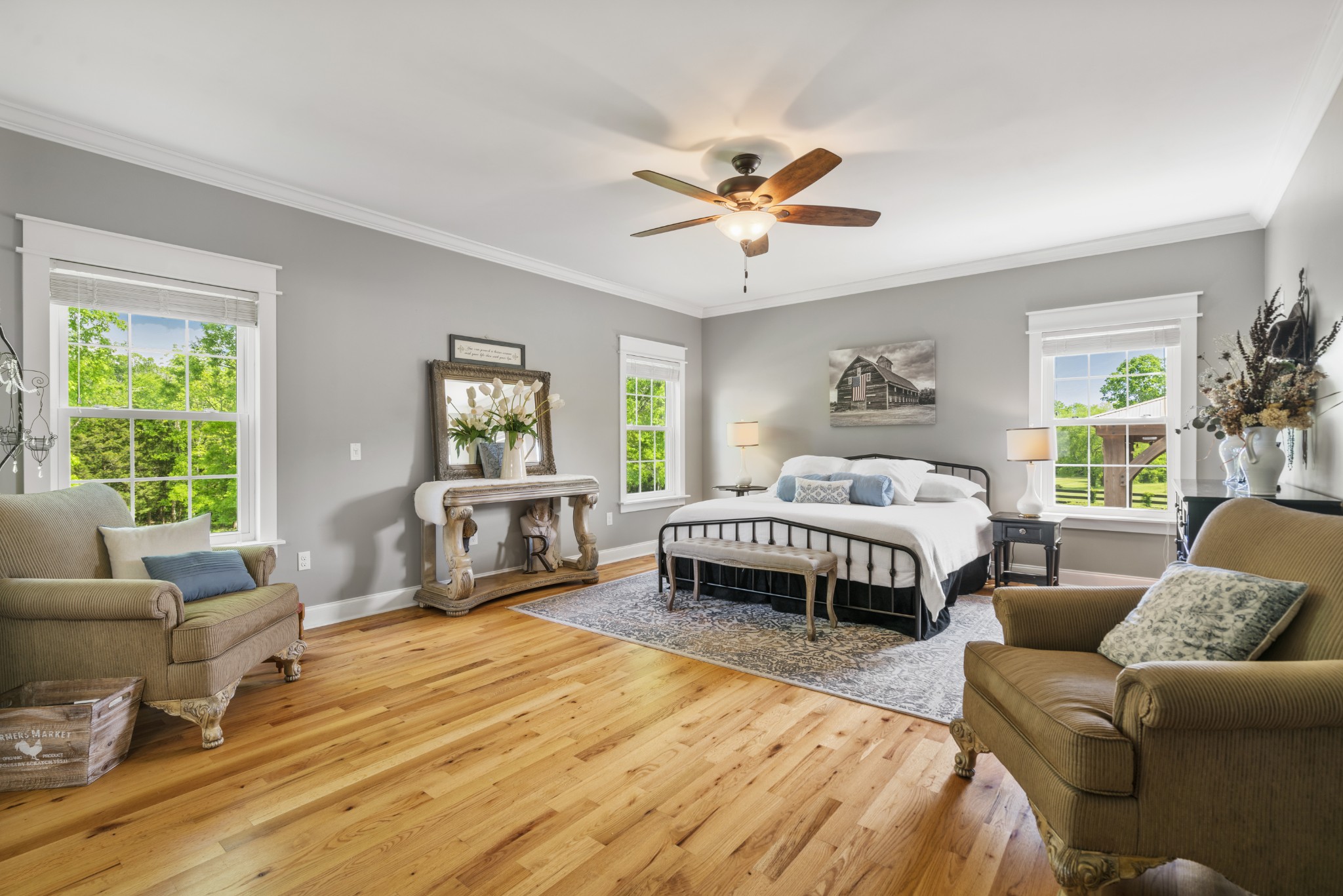 5235 Flat Creek Road Spring Hill, TN 37174 - Photo 25 of 65 a spacious bedroom with a bed a couch and a window