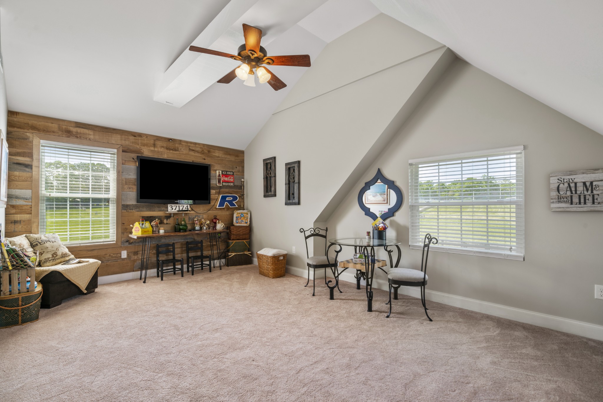 5235 Flat Creek Road Spring Hill, TN 37174 - Photo 36 of 65 a view of a livingroom with furniture a flat screen tv and a window