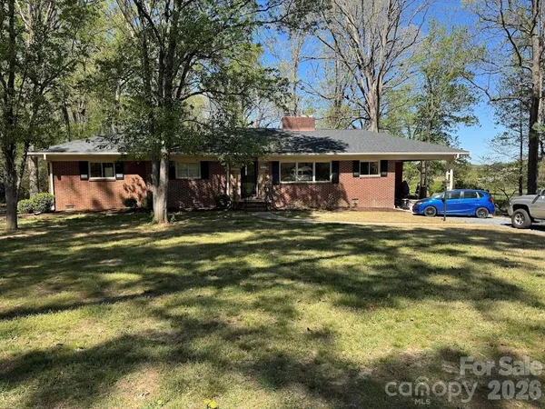 a front view of a house with swimming pool