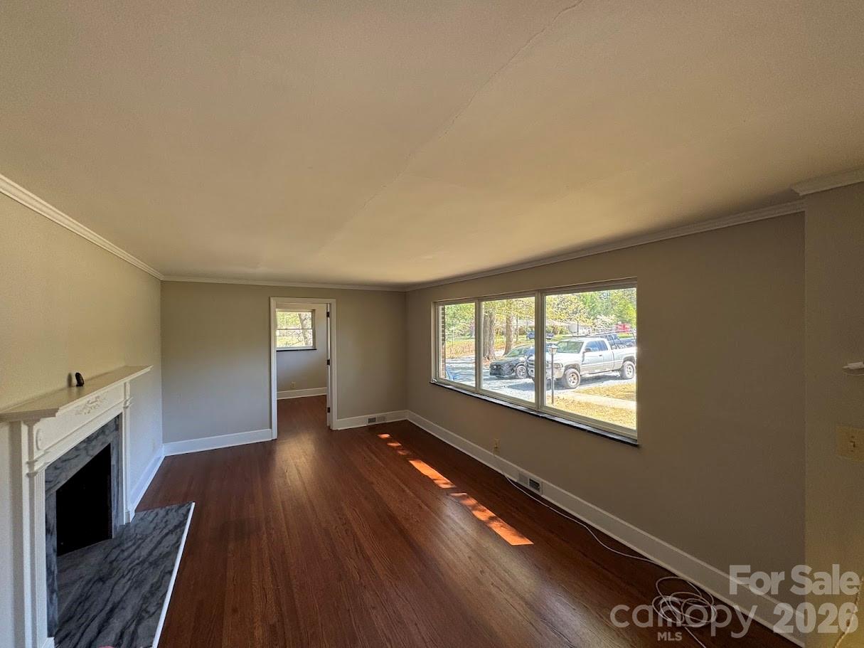 4424 Back Creek Church Road Charlotte, NC 28213 - Photo 2 of 15 wooden floor in an empty room with a window