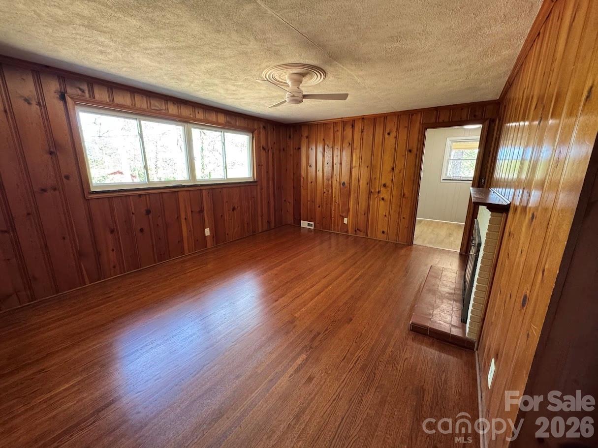 4424 Back Creek Church Road Charlotte, NC 28213 - Photo 3 of 15 an empty room with wooden floor and windows